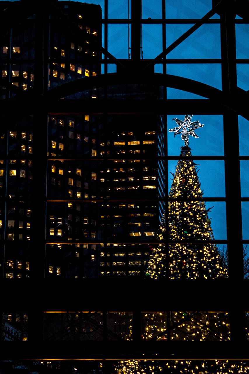 LOW ANGLE VIEW OF ILLUMINATED BUILDING