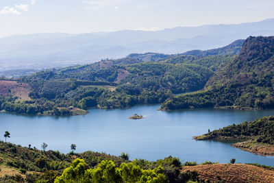 Scenic view of lake and mountains against sky