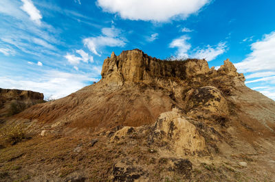 Low angle view of cliff against sky at tatacoa desert