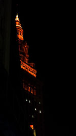 Low angle view of illuminated building at night
