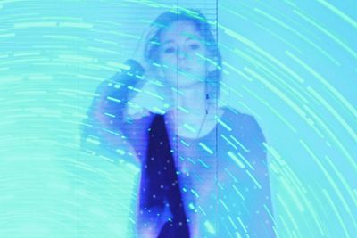 Low angle view of man standing in swimming pool