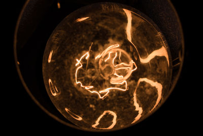 Close-up of illuminated light bulb