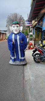 Person with umbrella on street in city