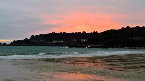 View of beach at sunset