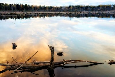 Scenic view of lake against sky during sunset