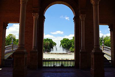 Architectural columns against cloudy sky