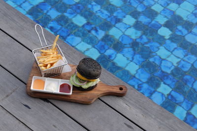 High angle view of food on table at swimming pool