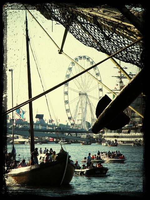 transfer print, nautical vessel, transportation, water, mode of transport, architecture, boat, built structure, auto post production filter, waterfront, river, city, travel, building exterior, travel destinations, sailing, bridge - man made structure, moored, sailboat, mast