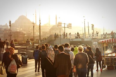 People walking on street in city