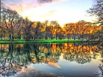 Scenic view of lake at sunset