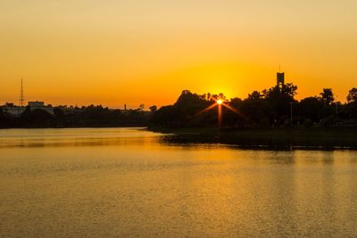 Scenic view of lake at sunset