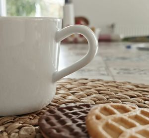 Close-up of coffee cup on table