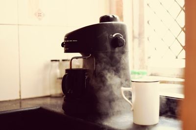 Close-up of coffee on table at home