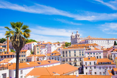 Buildings in city against sky