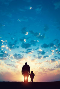 Silhouette man against sky during sunset