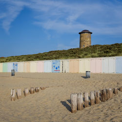 Scenic view of beach of domburg by sea against sky