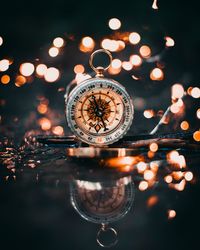 Close-up of illuminated lights in water at night