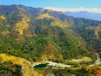 High angle view of trees and mountains against sky