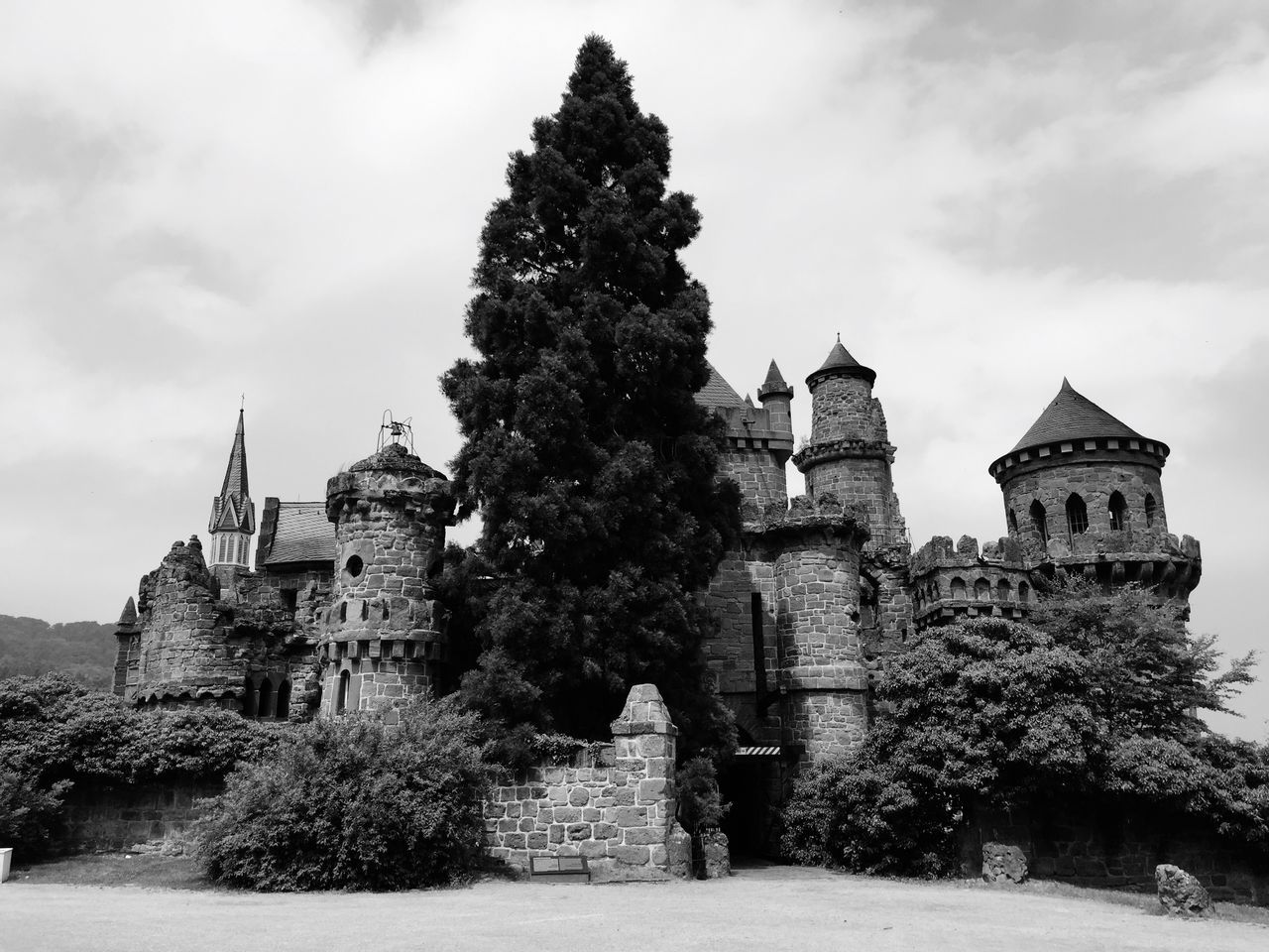 architecture, religion, built structure, place of worship, building exterior, spirituality, sky, tree, church, history, cloud - sky, low angle view, the past, temple - building, old, famous place, cross, travel destinations