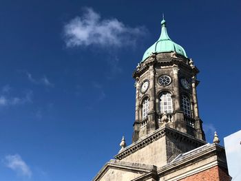 Low angle view of clock tower against sky