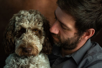 Close-up of man with dog