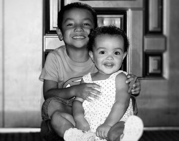 Portrait of smiling brother and sister