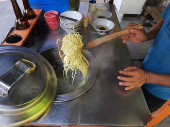 High angle view of people working on table