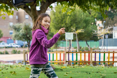 Smiling girl walking at park