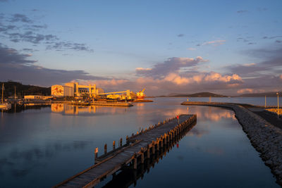 Scenic view of river against sky during sunset