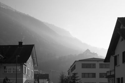 Houses and buildings against sky