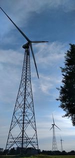 Low angle view of electricity pylon against sky