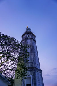 Low angle view of building against blue sky