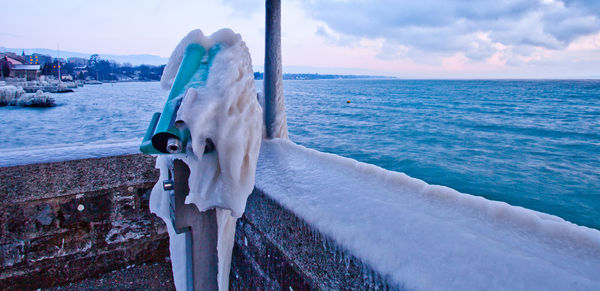 Calm blue sea against sky during winter