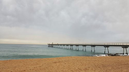 Pier over sea against sky