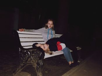 Portrait of man sitting on bench