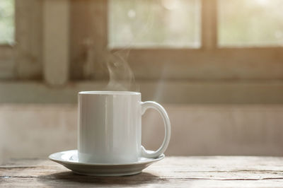 Close-up of coffee cup on table