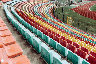 High angle view of colorful chairs at stadium