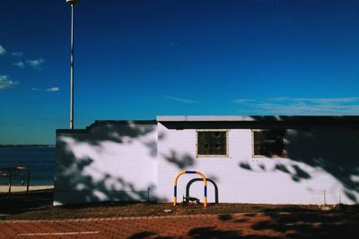View of trees against blue sky