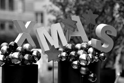 Close-up of christmas decorations hanging on sunny day