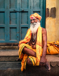 Man sitting in front of door