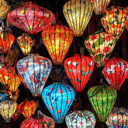 Brightly lit lanterns in hoi an night market hanging above. taken in hoi an, vietnam.