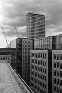 Modern buildings in city against sky