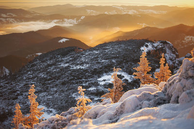 Scenic view of mountains against sky during winter