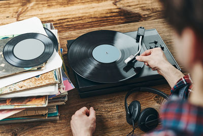 Listening to music from vinyl record. playing music from analog. retro music party. vintage style