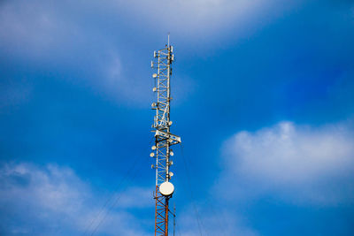 Low angle view of communications tower against sky