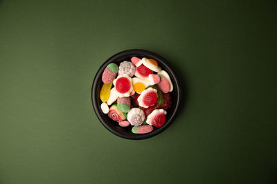 High angle view of multi colored candies in bowl