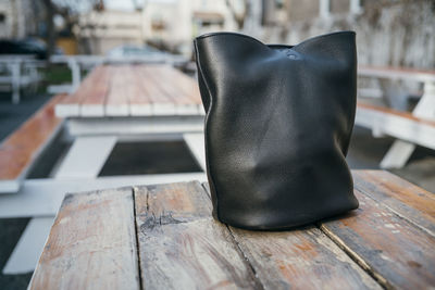 Close-up of black shoes on table