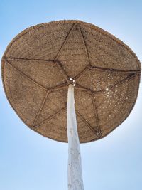 Low angle view of wind turbine against clear sky