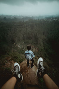 Rear view of people riding on mountain