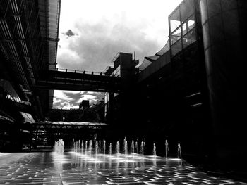 Bridge over river with buildings in background